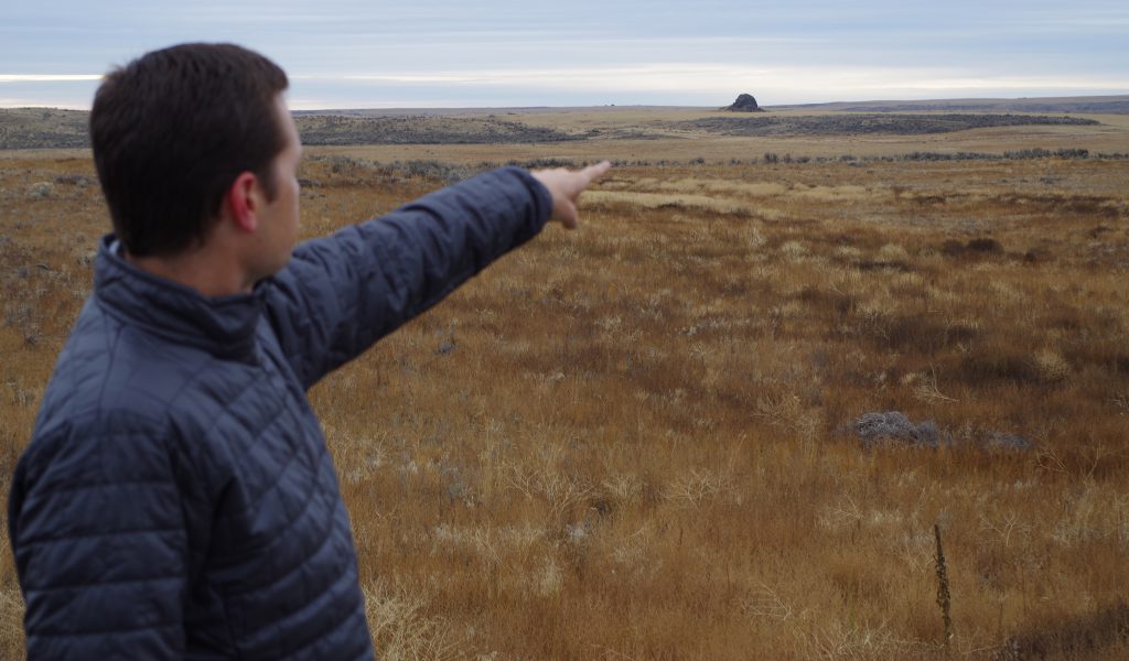 Michael Brown, SGI field capacity coordinator, points out a sage grouse mating lek on the Leander ranch in eastern Washington.